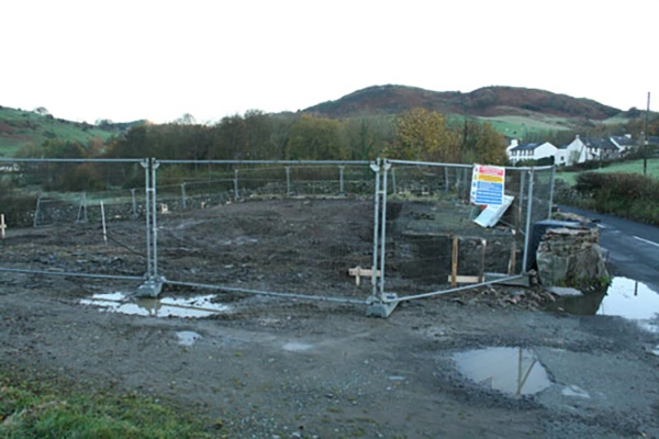 Demolition of the old hall site with fencing around the area where the new The Community Hall Grizebeck will be built, 13 November 2010